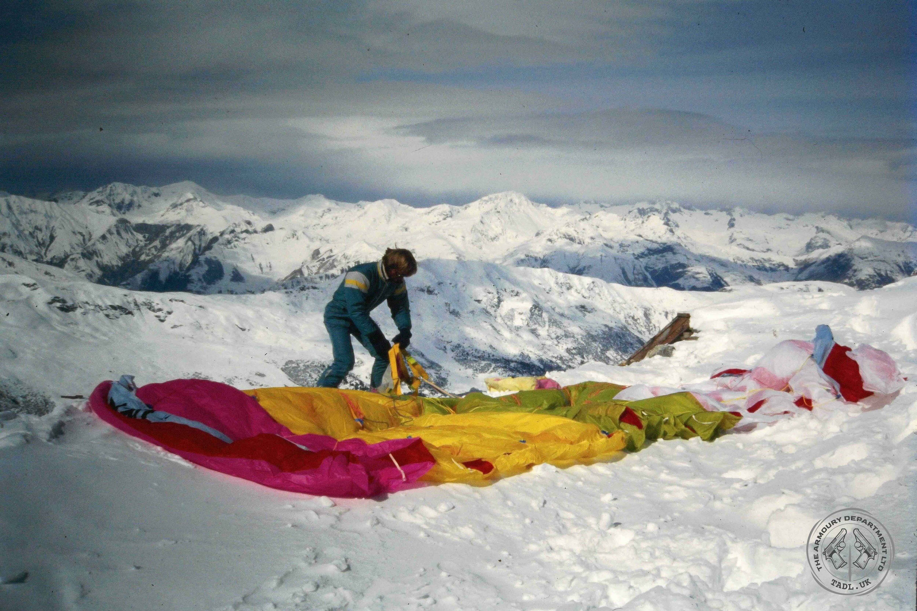 Preparing a canopy to paraglide among the French Alps near Meribel in France